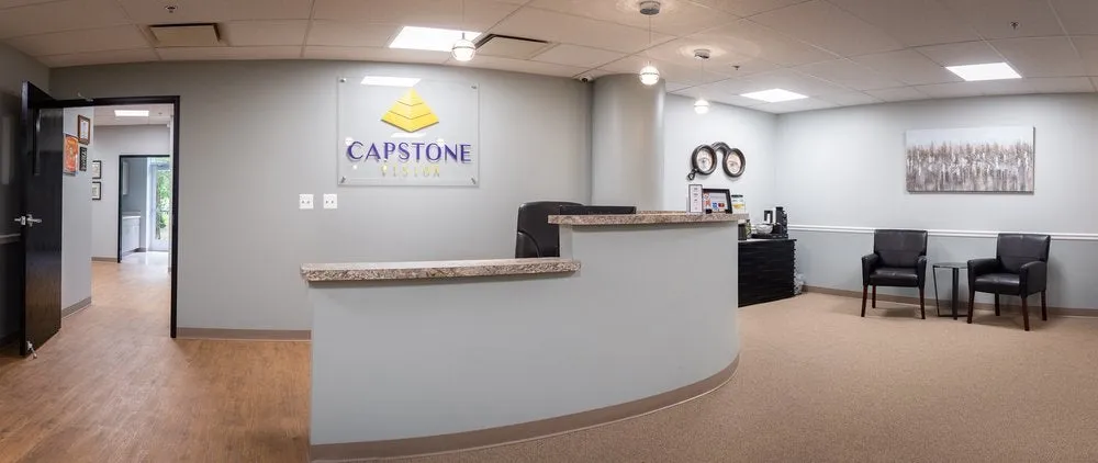 Clean, professional medical spa treatment room with neutral tones at Capstone Vision in Auburn Hills