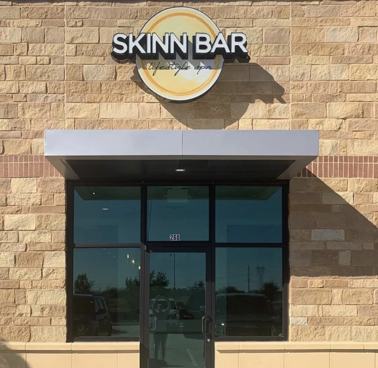 Clean, professional medical spa treatment room with neutral tones at Skinn Bar - Frisco in Frisco