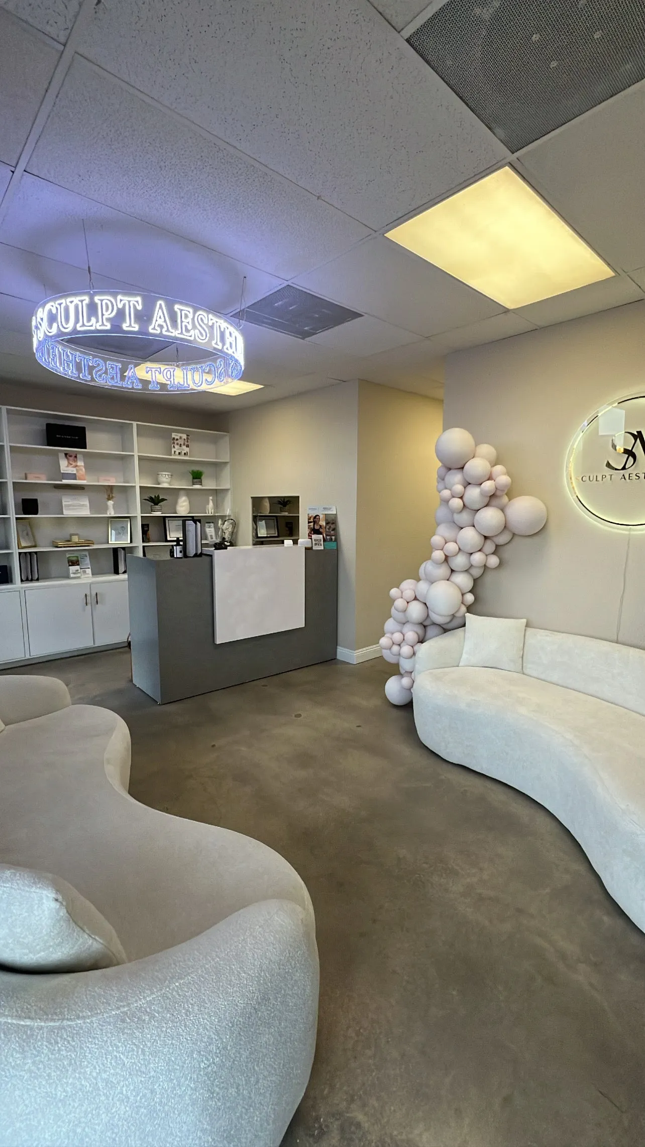Clean, professional medical spa treatment room with neutral tones at Sculpt Aesthetics Med Spa in Seal Beach