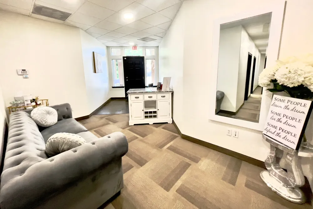Clean, professional medical spa treatment room with neutral tones at Perfekt Union Aesthetics in Visalia