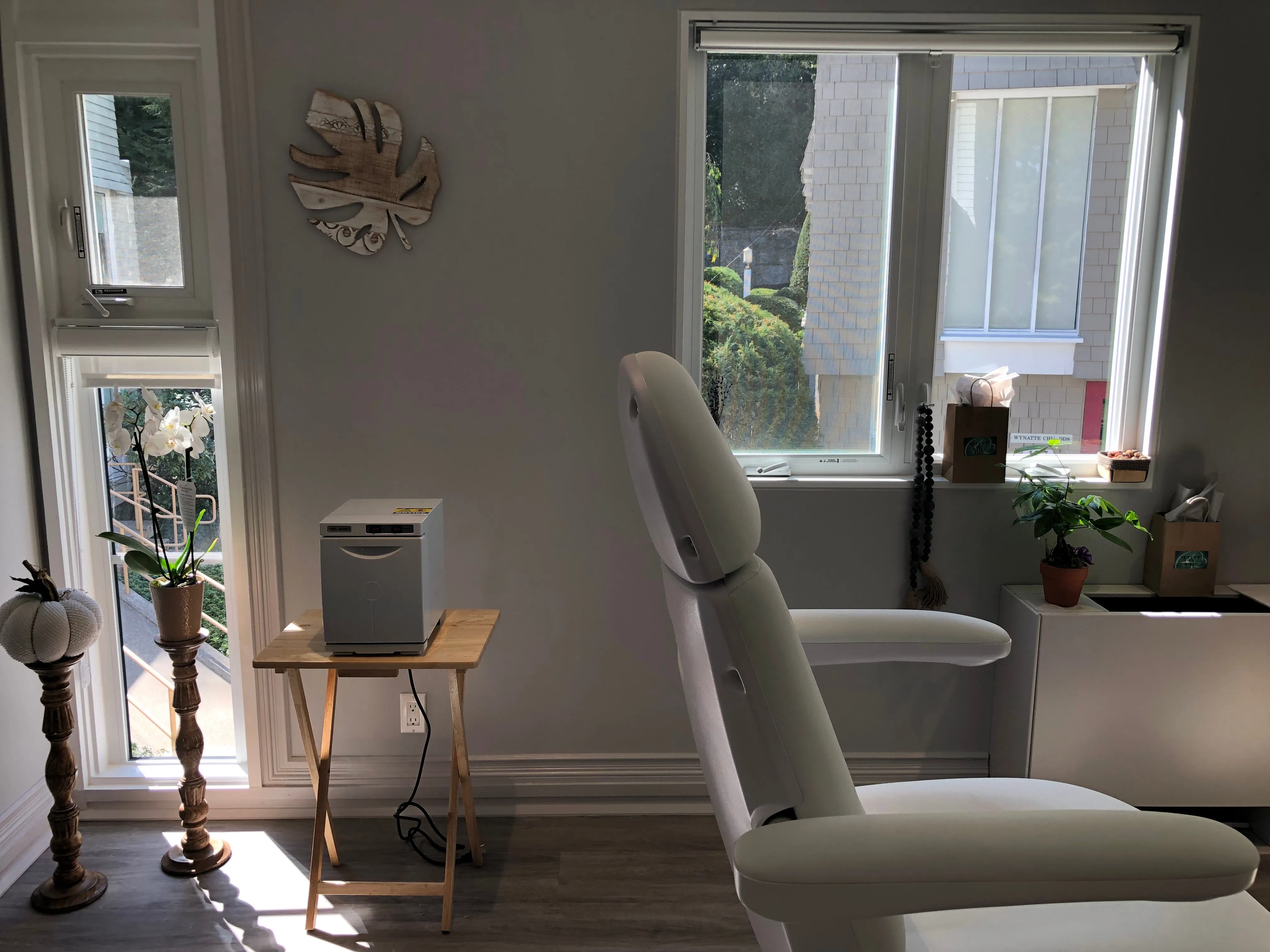 Clean, professional medical spa treatment room with neutral tones at Wisdom and Youth in Westport