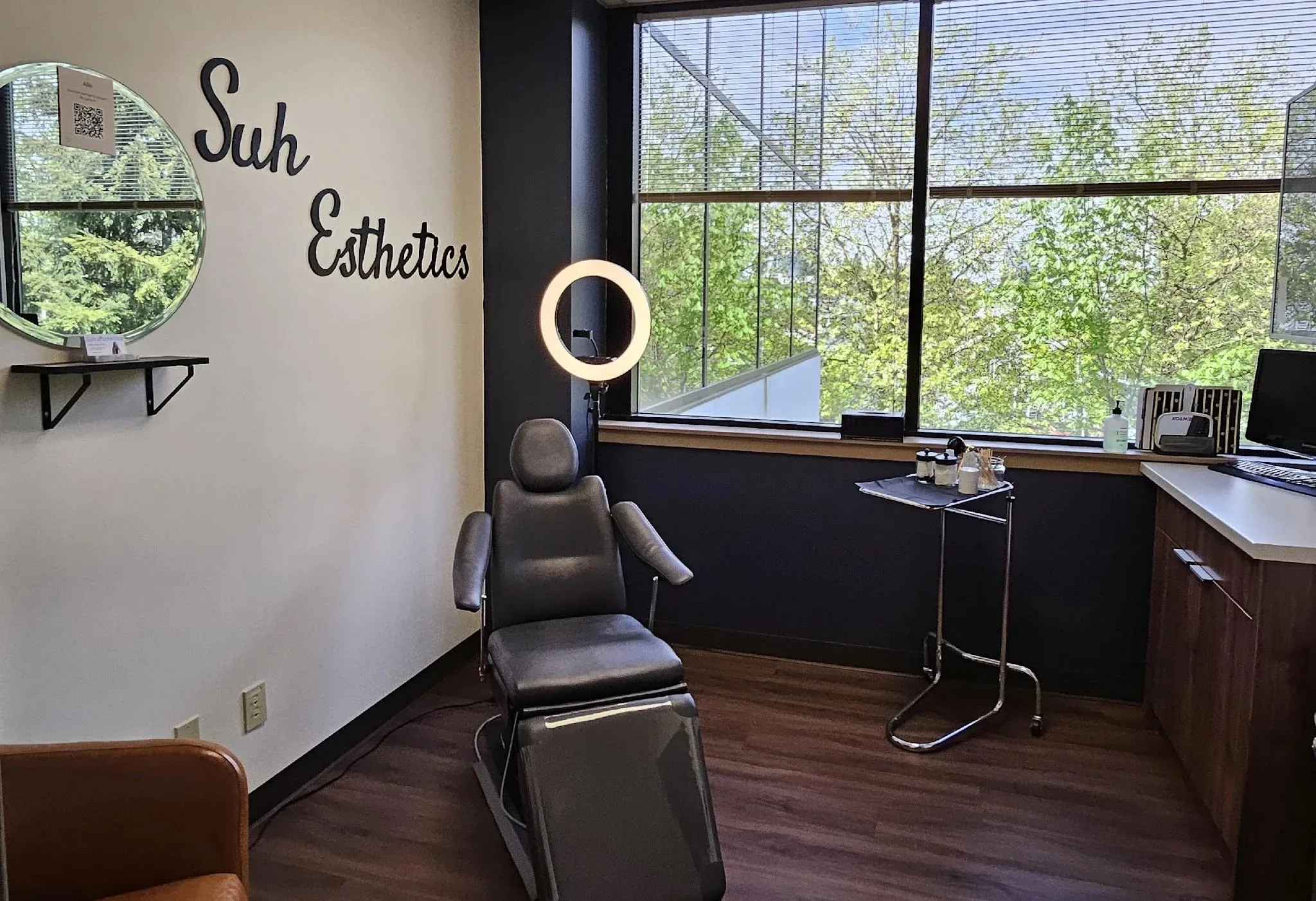 Clean, professional medical spa treatment room with neutral tones at Suh Esthetics in Bellevue