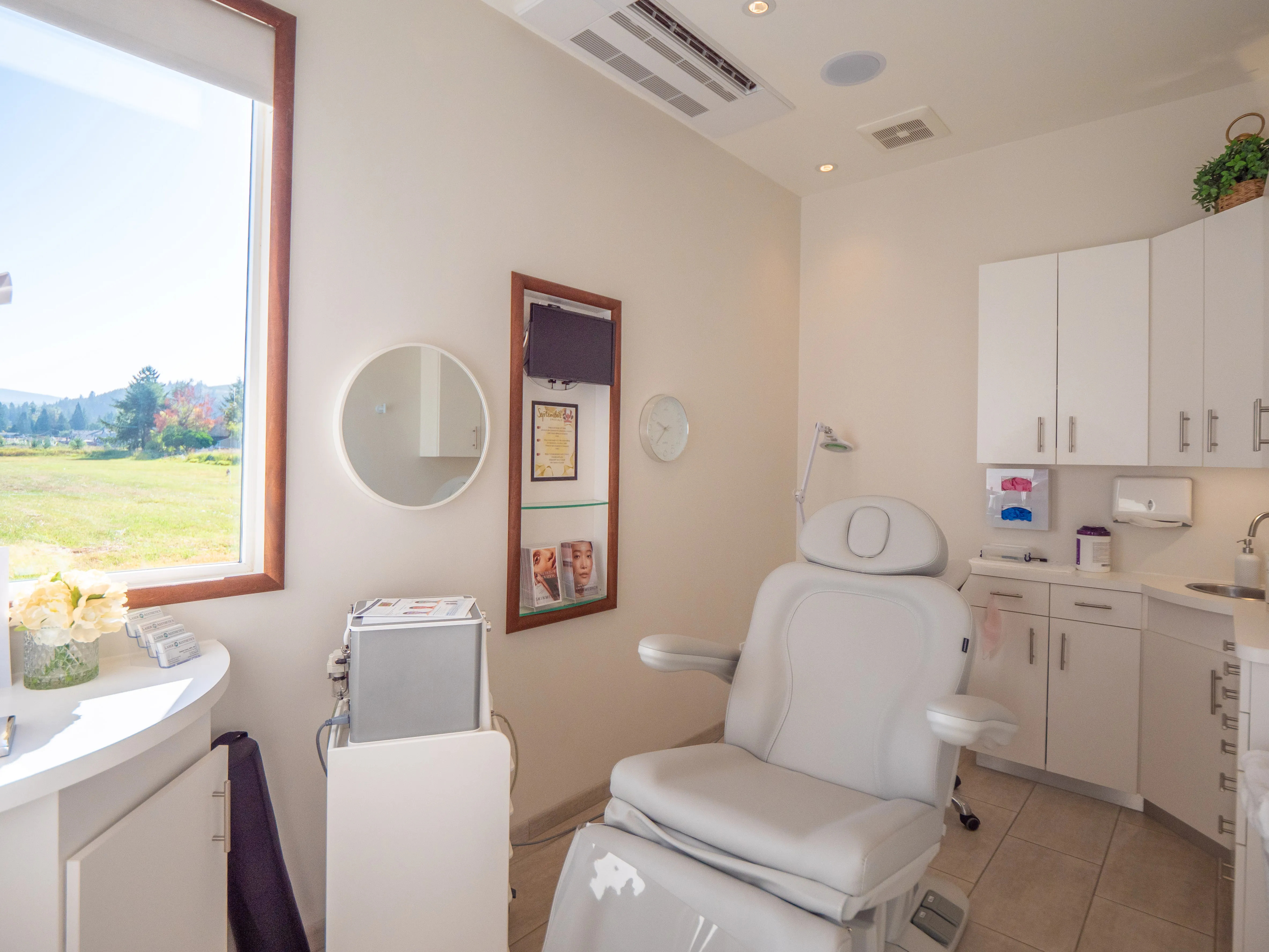 Clean, professional medical spa treatment room with neutral tones at Rainier Laser & Aesthetics Center in Enumclaw