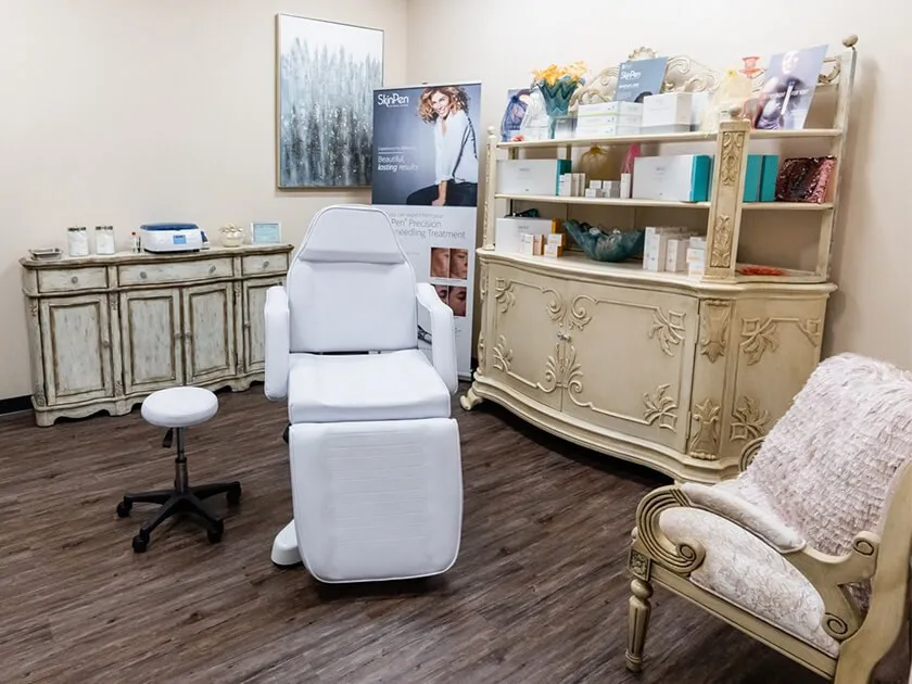 Clean, professional medical spa treatment room with neutral tones at AestheticFx in Frisco