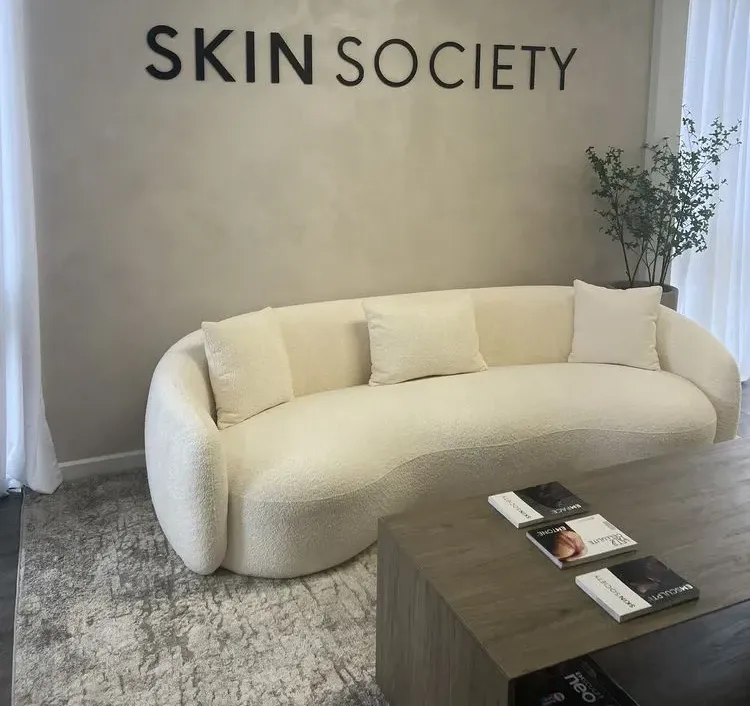 Clean, professional medical spa treatment room with neutral tones at Skin Society in Newport Beach