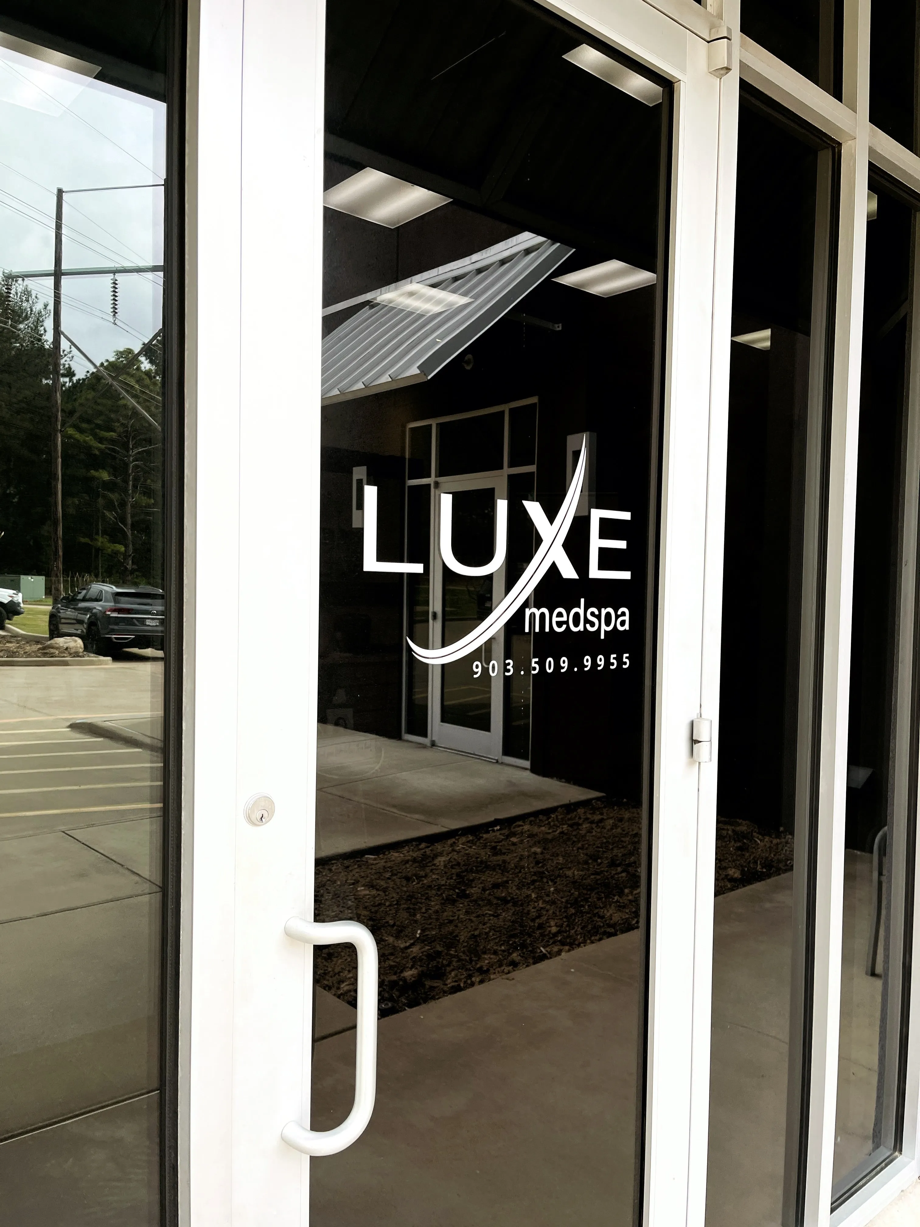 Clean, professional medical spa treatment room with neutral tones at Luxe Medical Spa in Tyler