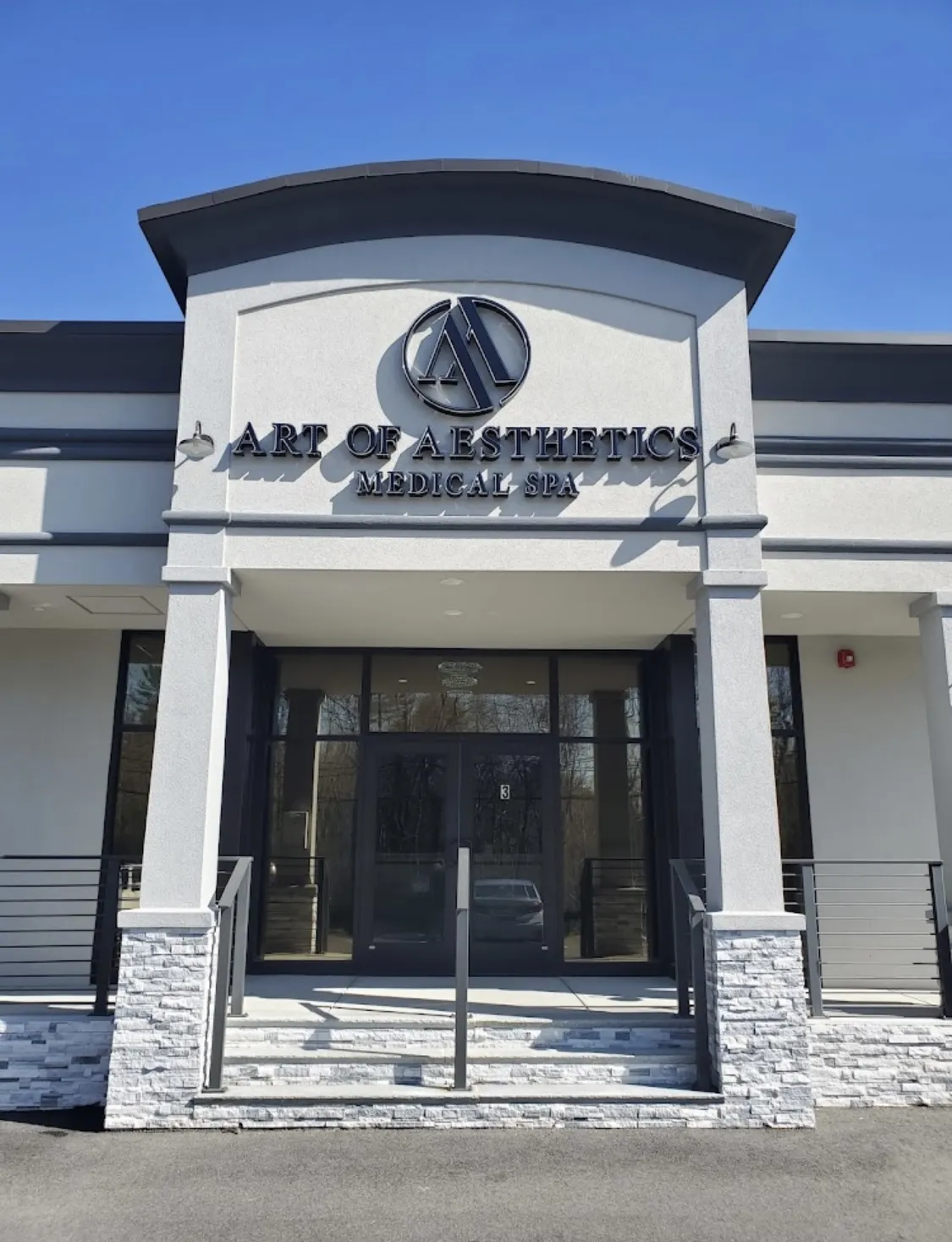 Clean, professional medical spa treatment room with neutral tones at Art of Aesthetics Medical Spa (West Bridgewater) in West Bridgewater
