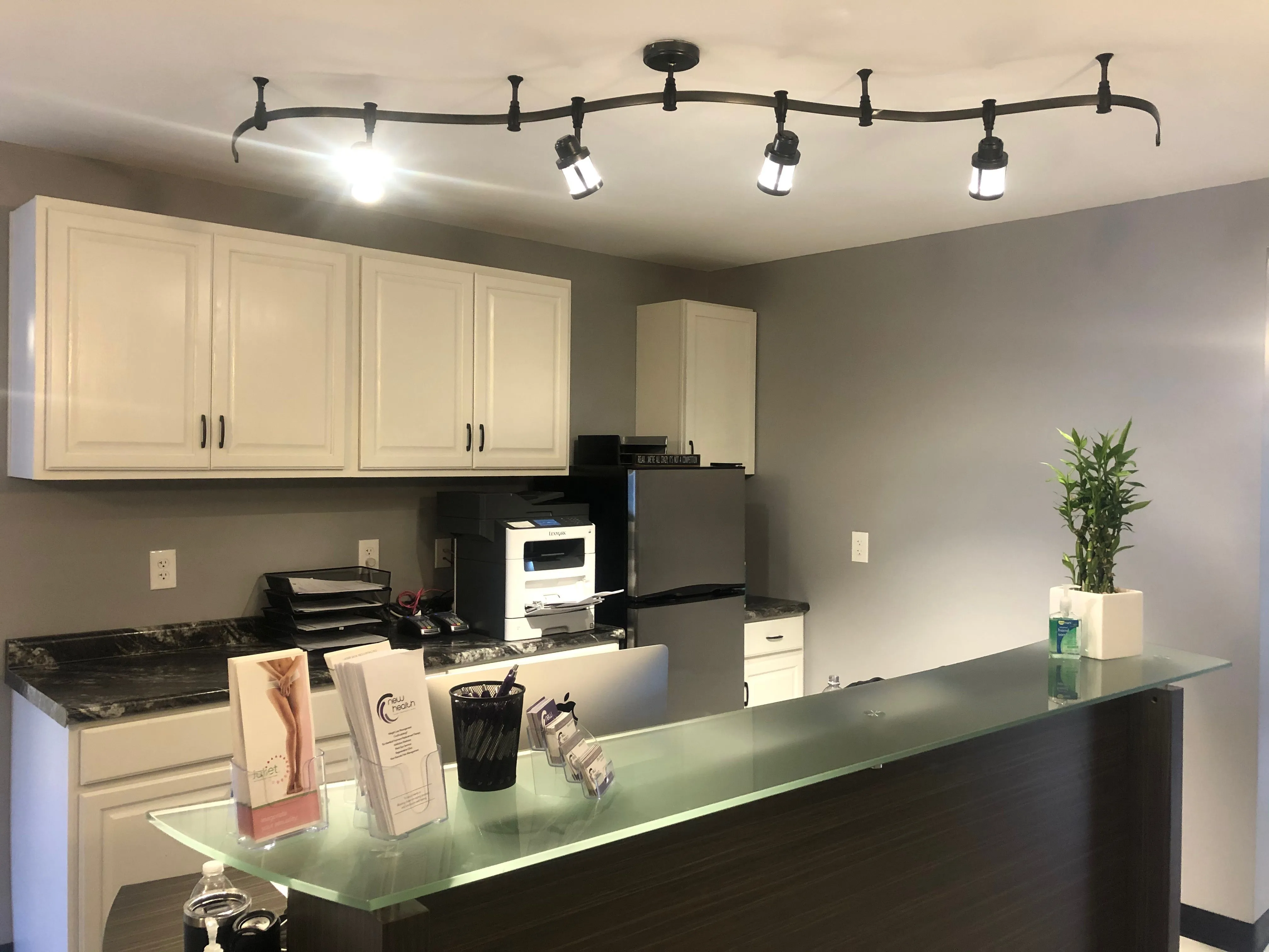 Clean, professional medical spa treatment room with neutral tones at New Health Topeka in Topeka
