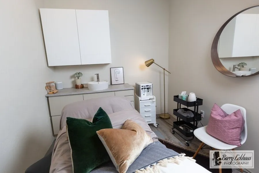 Clean, professional medical spa treatment room with neutral tones at Revival in Edwards