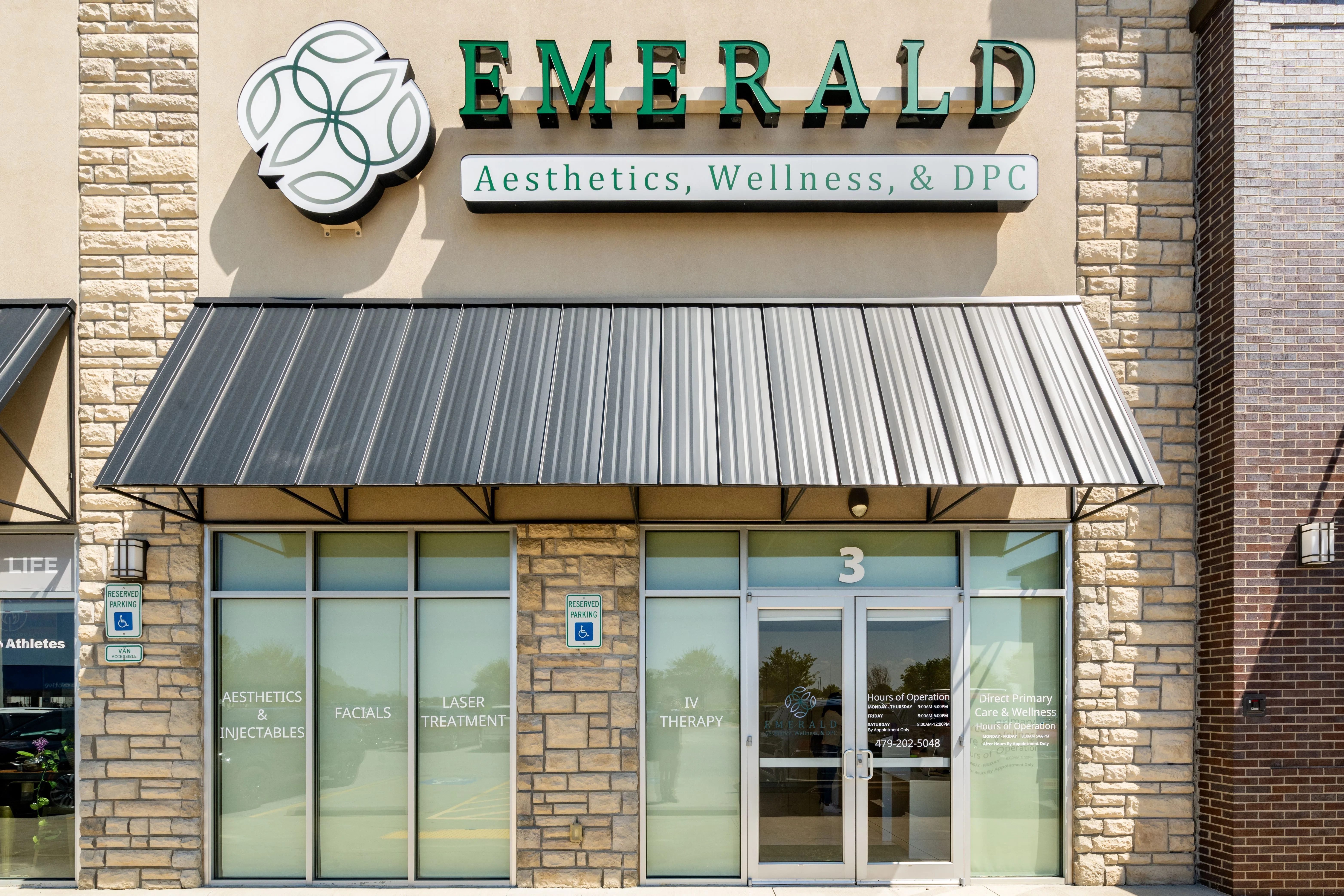 Clean, professional medical spa treatment room with neutral tones at Emerald Aesthetics in Rogers
