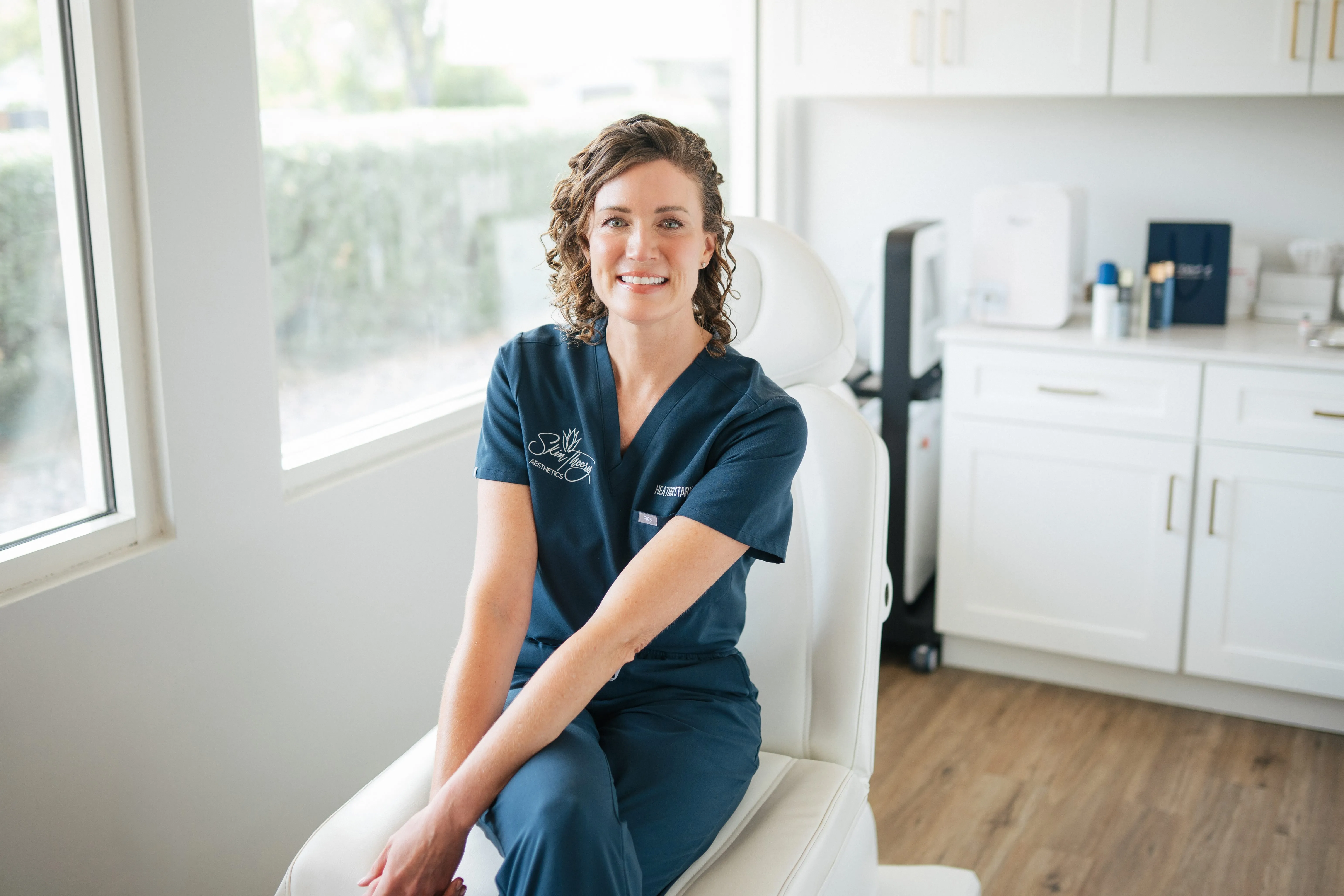 Clean, professional medical spa treatment room with neutral tones at Skin Theory Aesthetics in Phoenix