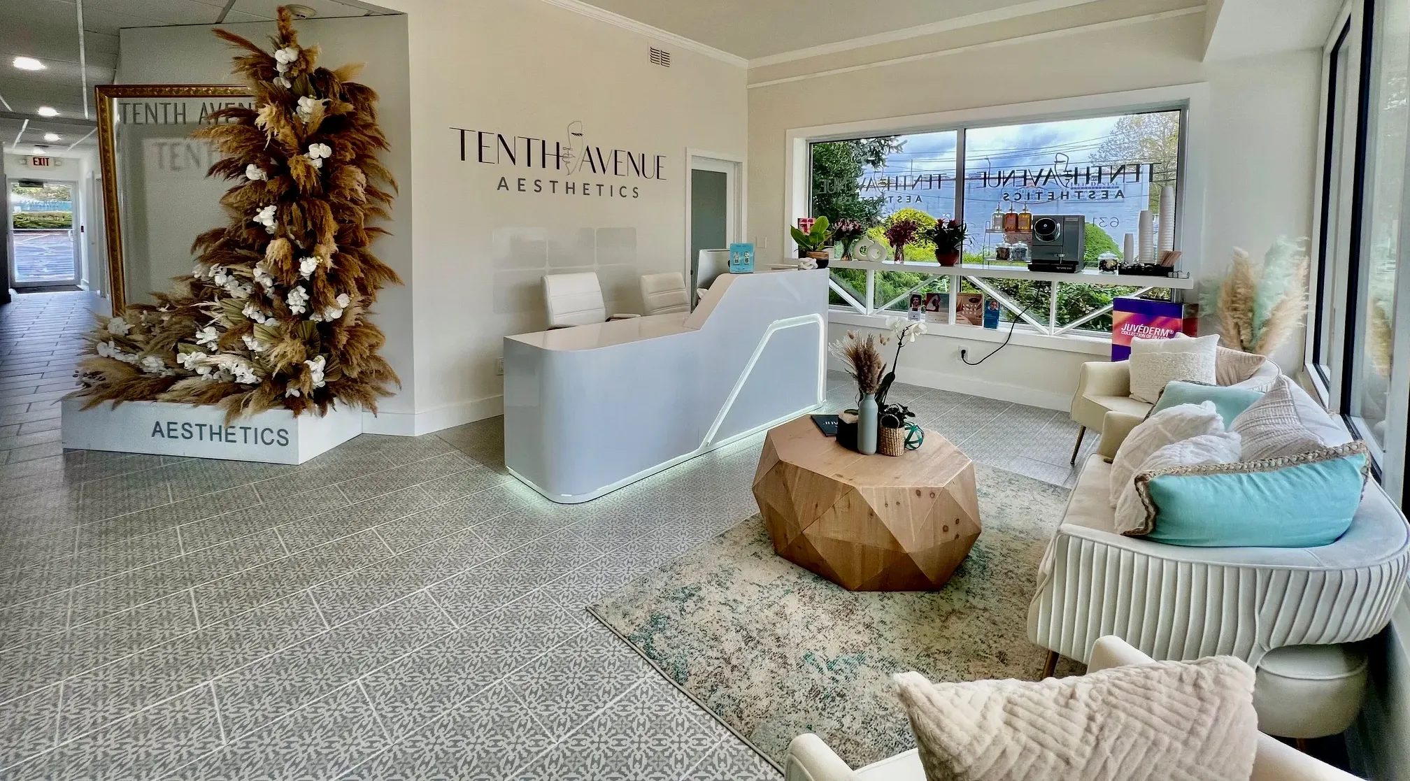 Clean, professional medical spa treatment room with neutral tones at Tenth Avenue Aesthetics Islip in Islip