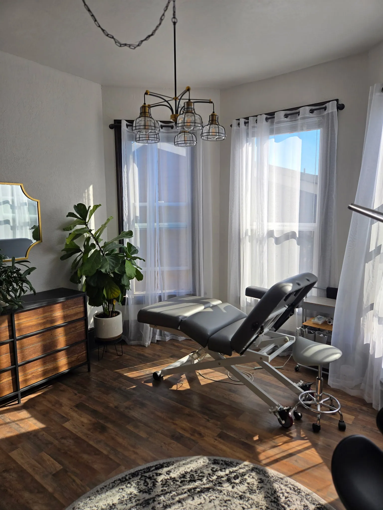 Clean, professional medical spa treatment room with neutral tones at Ashley Wilson Medical Aesthetics in Snohomish