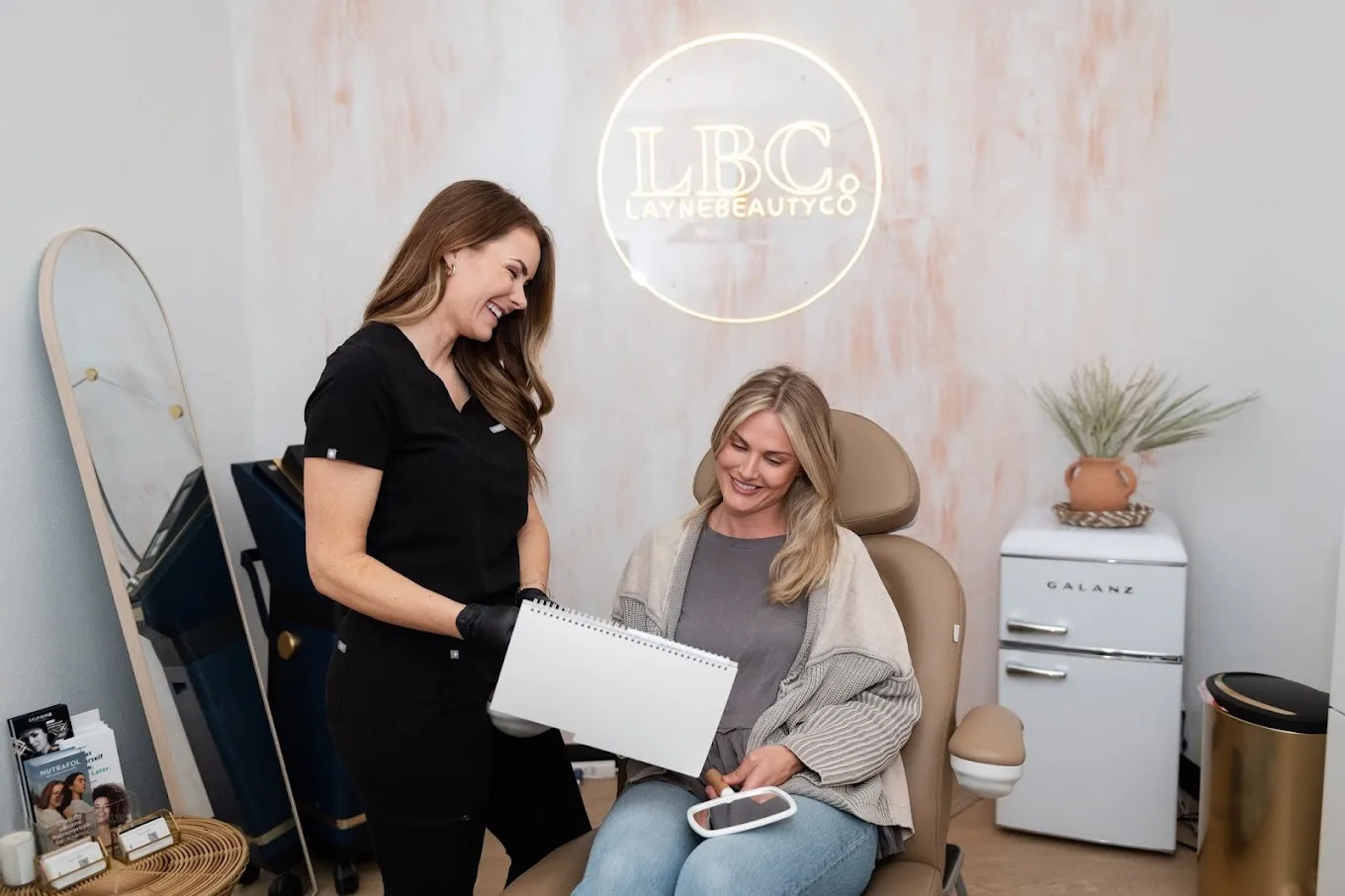 Clean, professional medical spa treatment room with neutral tones at LBC. Aesthetics + Wellness in Gilbert