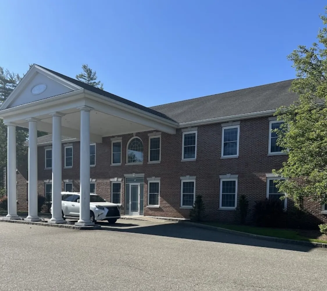 Clean, professional medical spa treatment room with neutral tones at Art of Aesthetics Medical Spa (Raynham) in Raynham