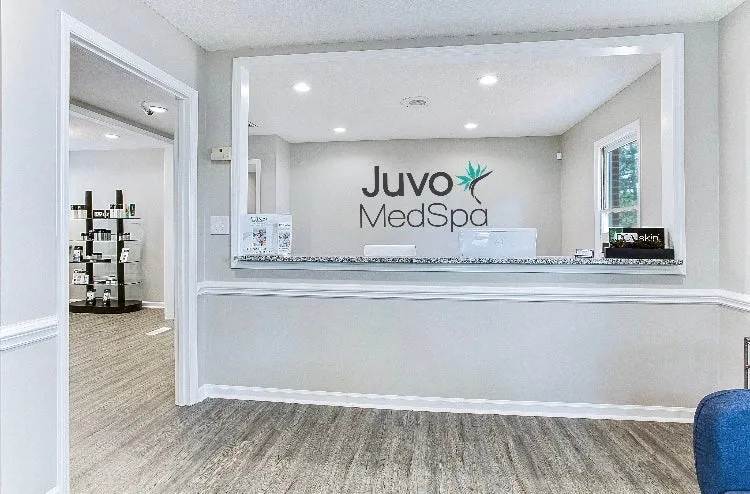 Clean, professional medical spa treatment room with neutral tones at Juvo Medspa in Southern Pines