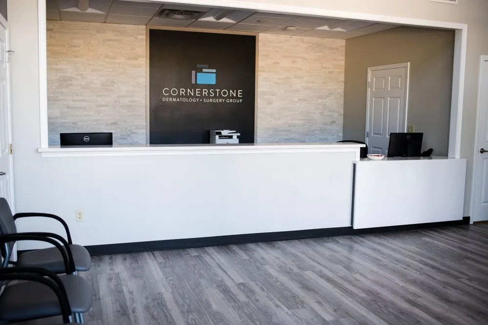 Clean, professional medical spa treatment room with neutral tones at Cornerstone Dermatology in Lees Summit