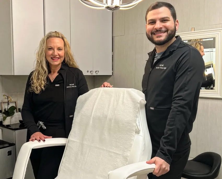 Clean, professional medical spa treatment room with neutral tones at Niche Aesthetics in Auburn