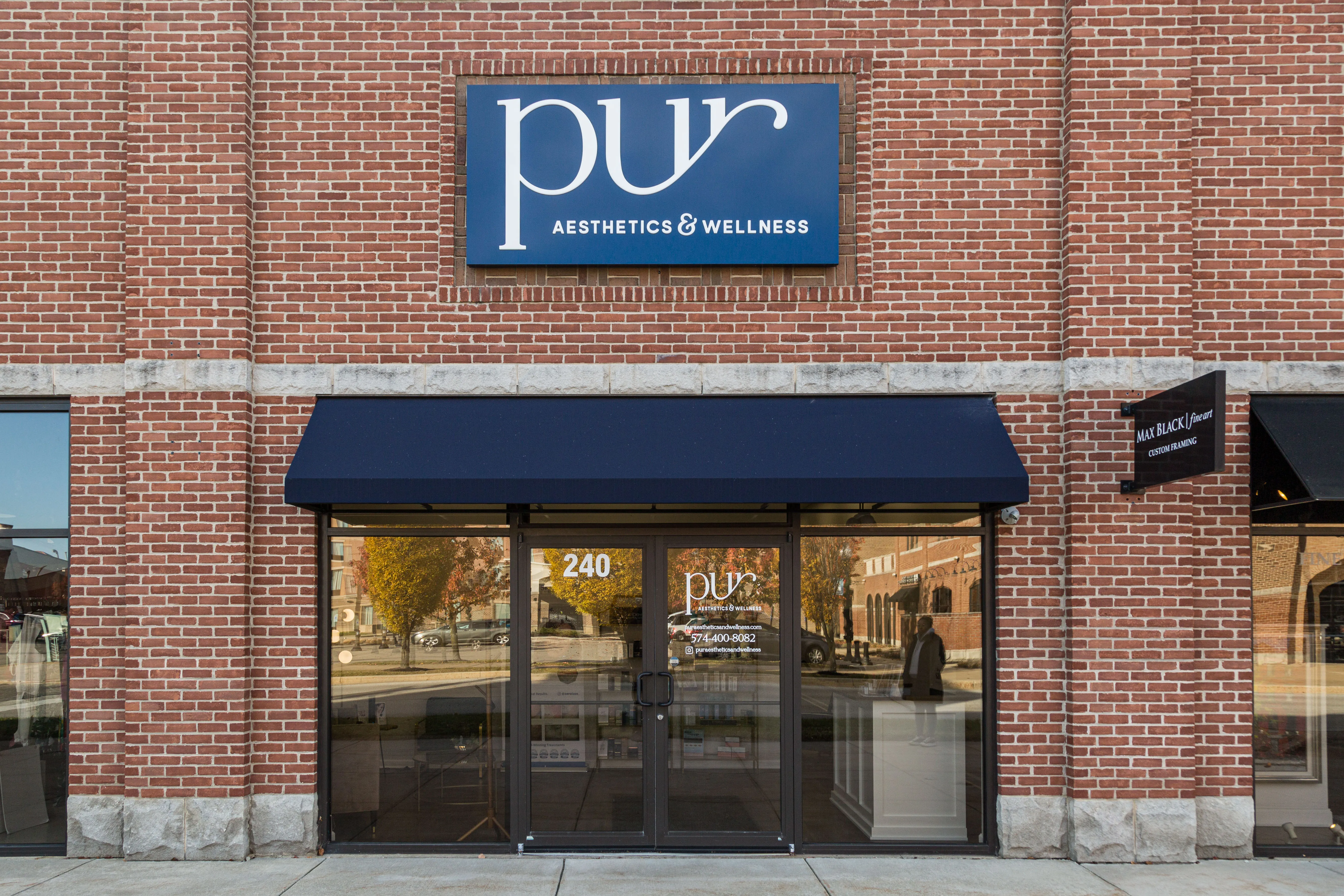Clean, professional medical spa treatment room with neutral tones at Pur Aesthetics & Wellness in Granger