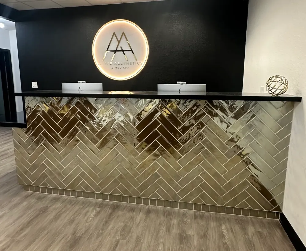 Clean, professional medical spa treatment room with neutral tones at Alyne Aesthetics in Tracy