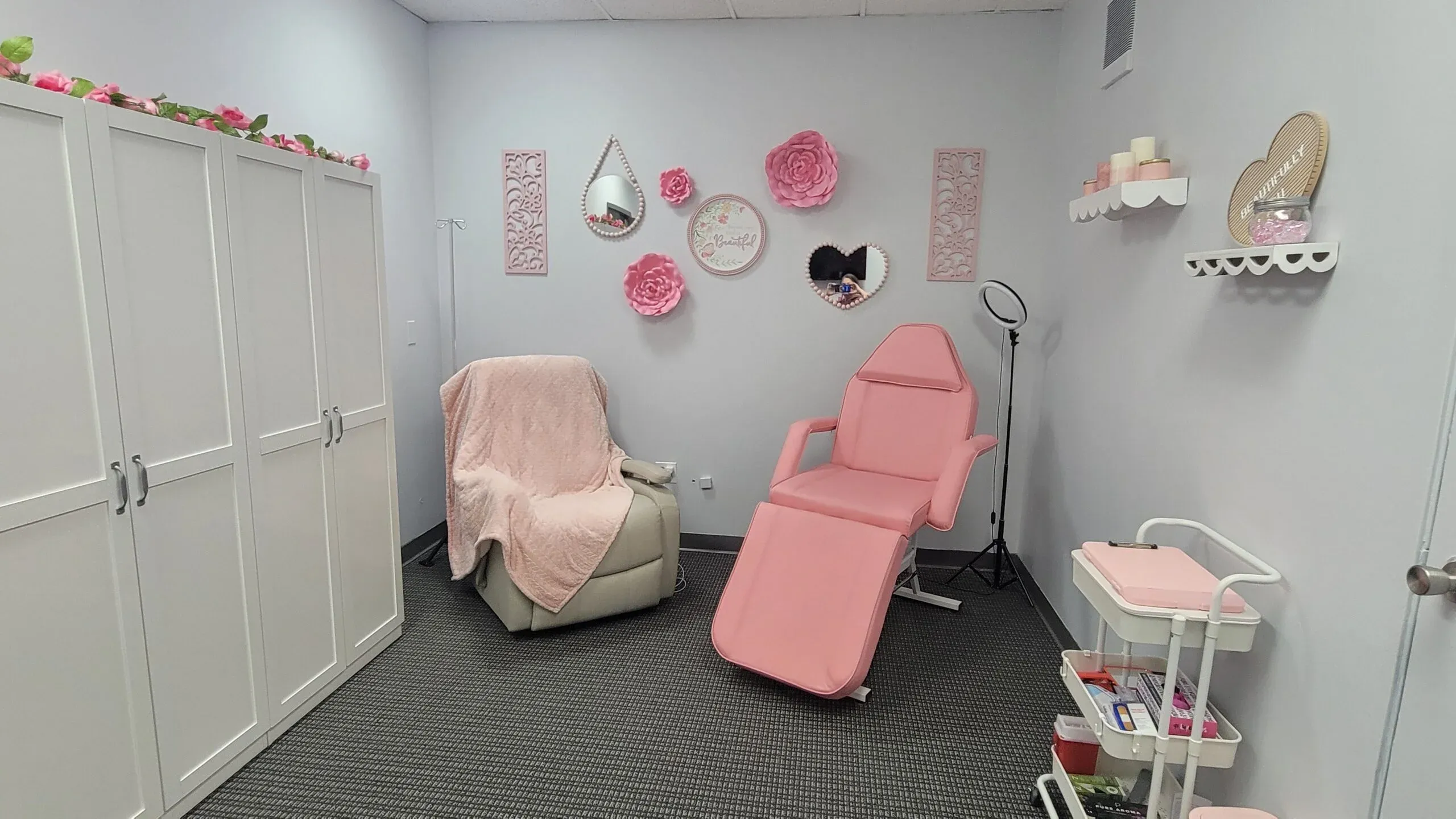 Clean, professional medical spa treatment room with neutral tones at Beautifully You in Gardner