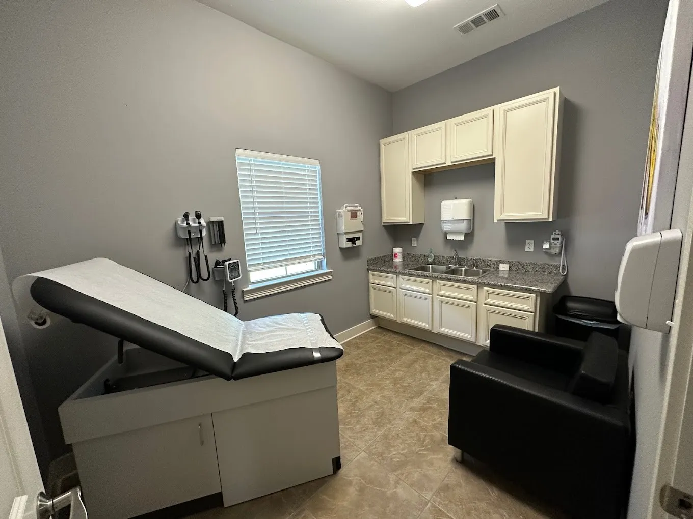 Clean, professional medical spa treatment room with neutral tones at Nola Family Clinic in Covington