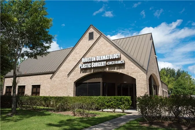 Clean, professional medical spa treatment room with neutral tones at Houston Derm & Plastic Surgery in Katy