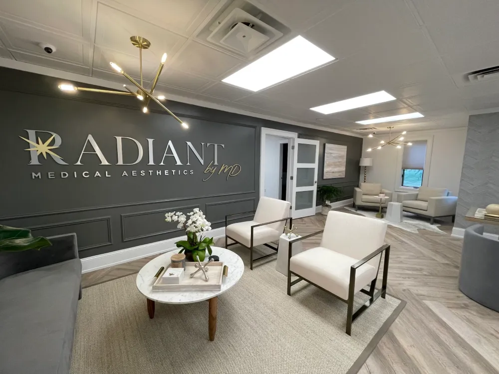 Clean, professional medical spa treatment room with neutral tones at Radiant by MD in Morganville