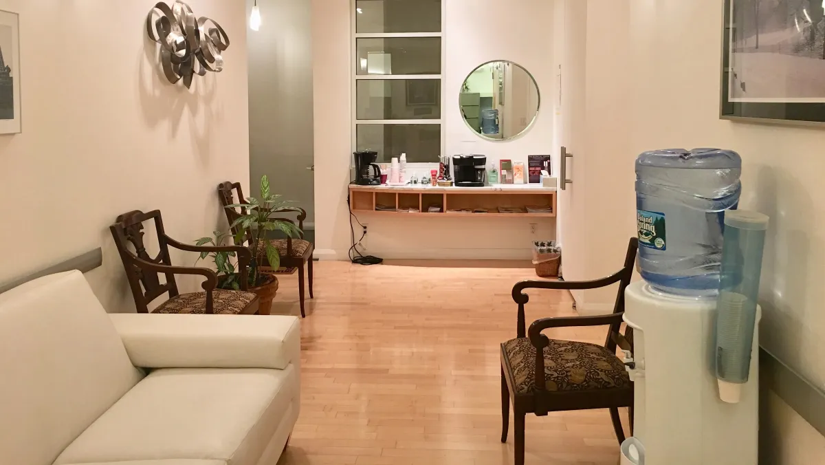 Clean, professional medical spa treatment room with neutral tones at Michele Anzilotti in New York