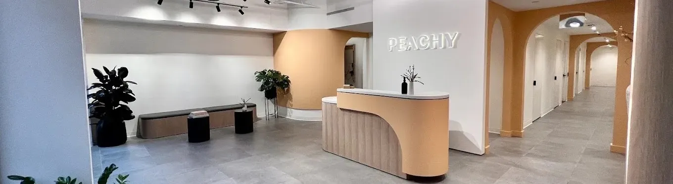 Clean, professional medical spa treatment room with neutral tones at Peachy - Bleecker St. in New York