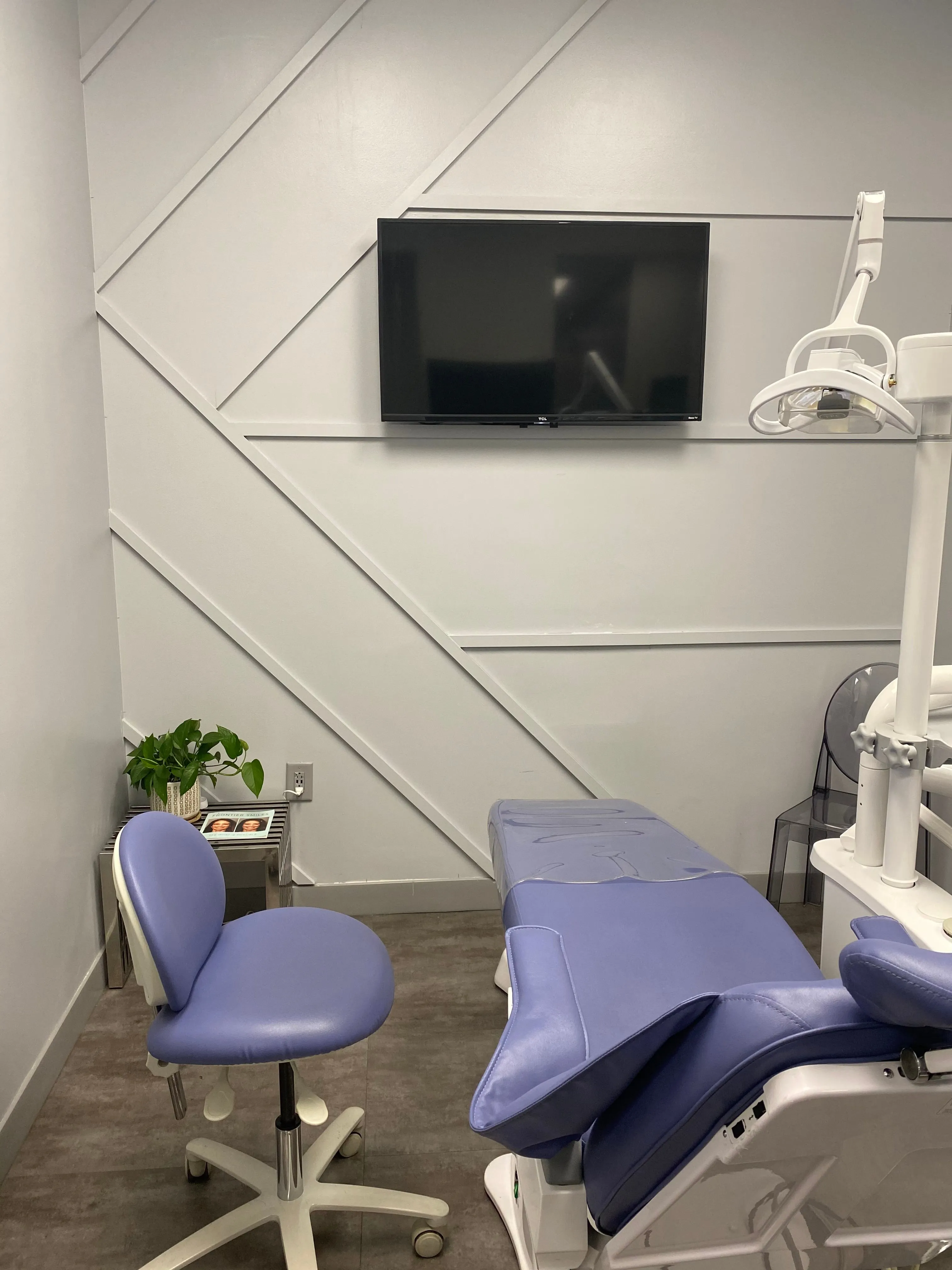 Clean, professional medical spa treatment room with neutral tones at Monica Patel in MATTHEWS