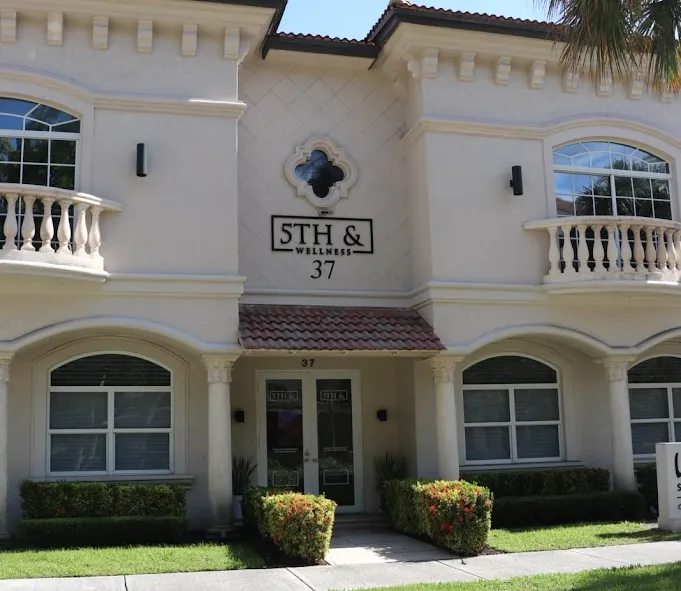 Clean, professional medical spa treatment room with neutral tones at 5th & Wellness in Boca Raton