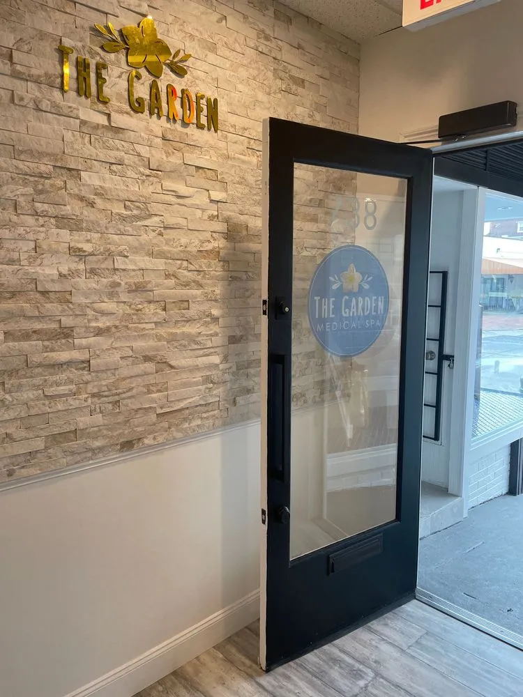 Clean, professional medical spa treatment room with neutral tones at Garden MedSpa- Collingswood in Collingswood