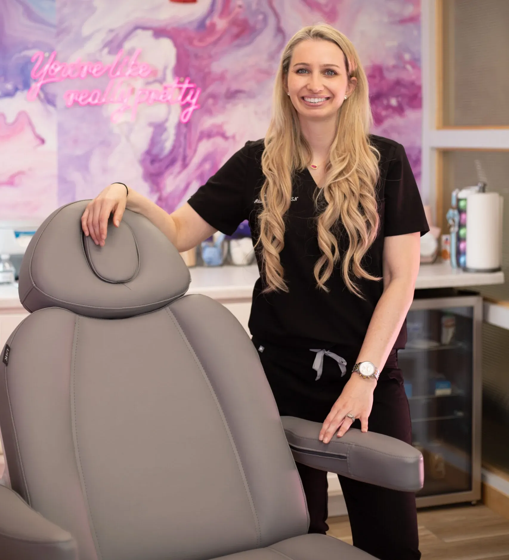 Clean, professional medical spa treatment room with neutral tones at Estella Aesthetics & Medspa in Monona