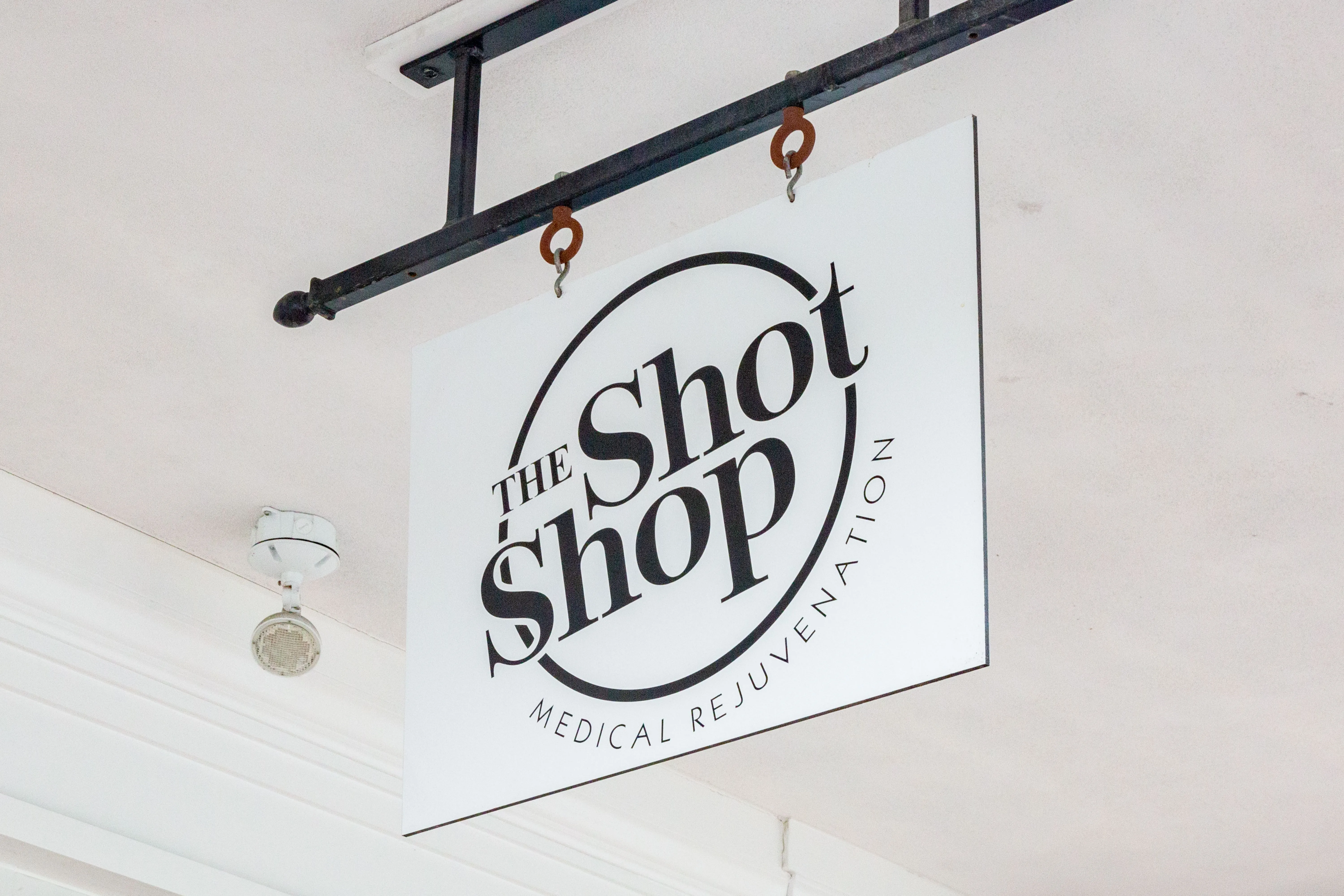 Clean, professional medical spa treatment room with neutral tones at The Shot Shop - Longmeadow in Longmeadow