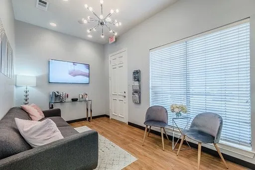 Clean, professional medical spa treatment room with neutral tones at Laser Essentials in Plano