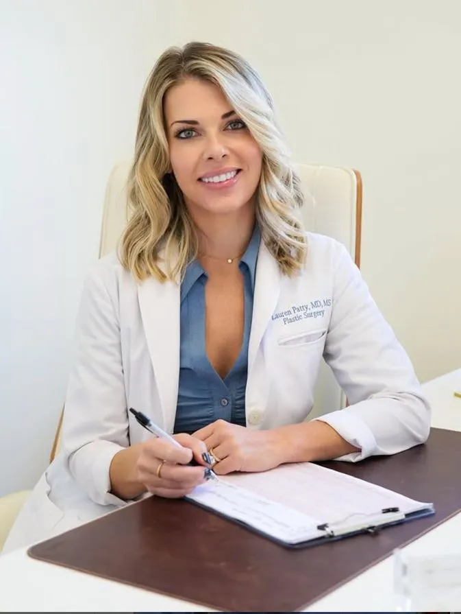 Clean, professional medical spa treatment room with neutral tones at Lauren Patty, MD in Newport Beach