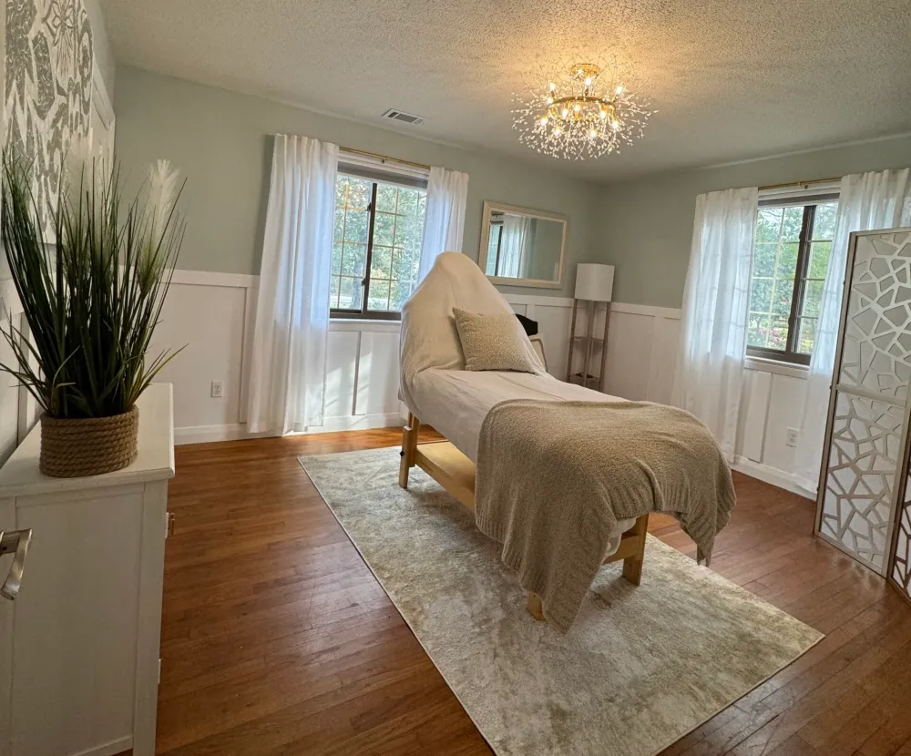 Clean, professional medical spa treatment room with neutral tones at Renew CHS in Summerville