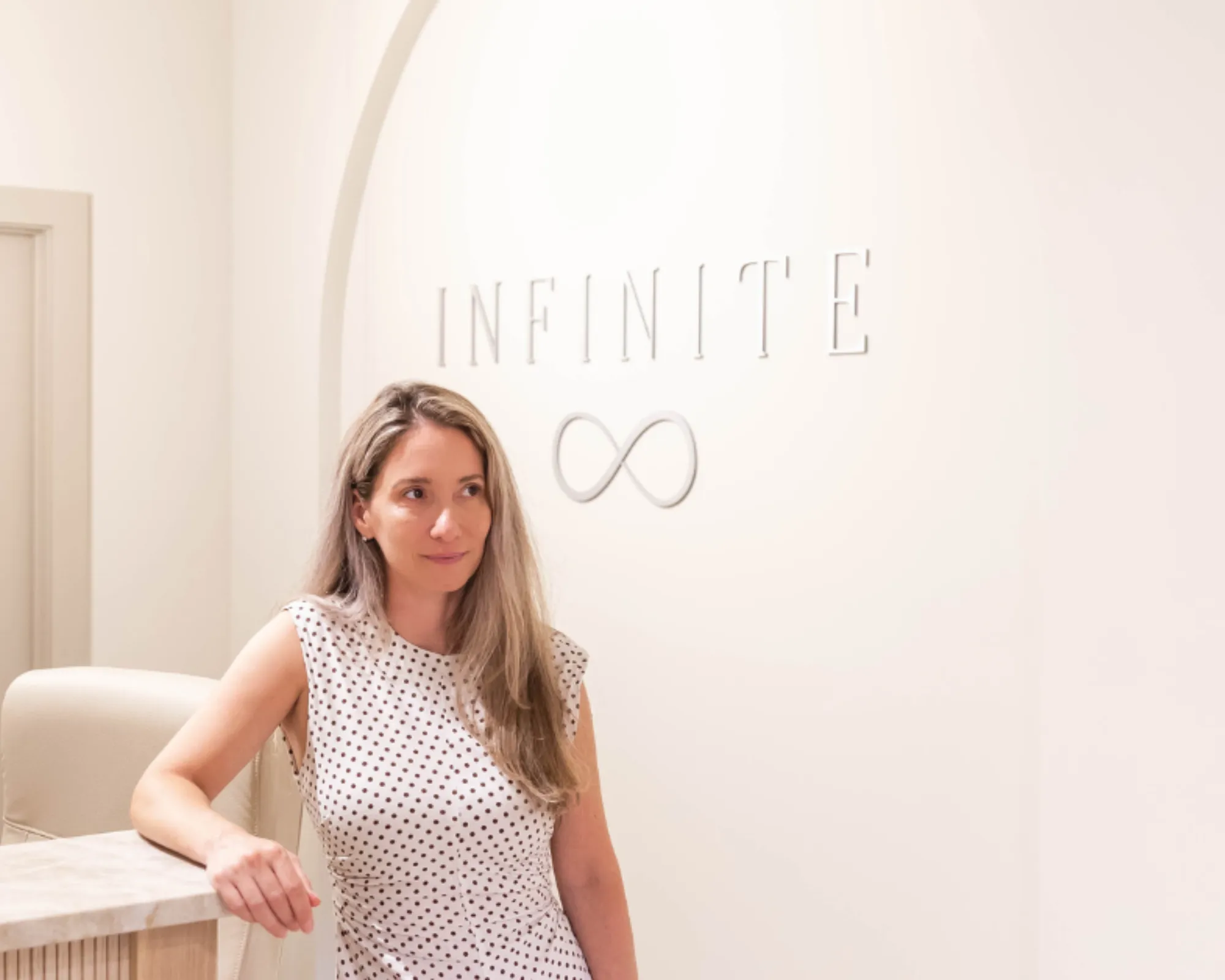 Clean, professional medical spa treatment room with neutral tones at Infinite Wellness & Aesthetics in Biddeford