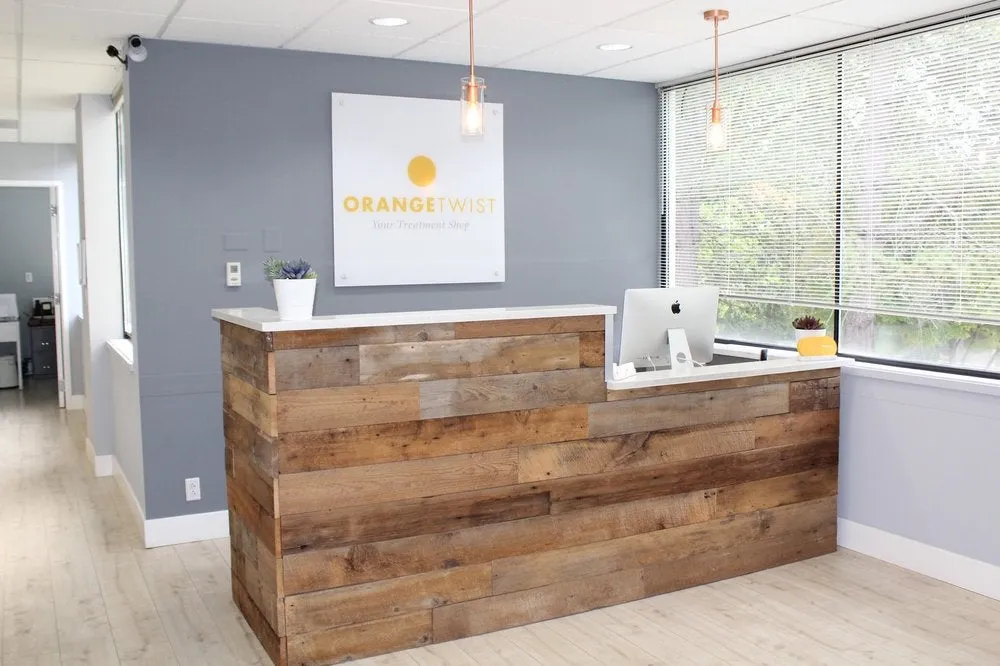 Clean, professional medical spa treatment room with neutral tones at Orange Twist- Bellevue in Bellevue