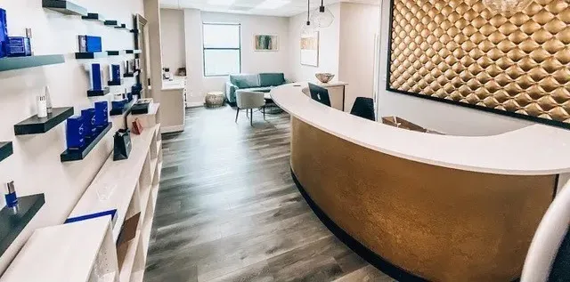 Clean, professional medical spa treatment room with neutral tones at The ReCenter in Coralville