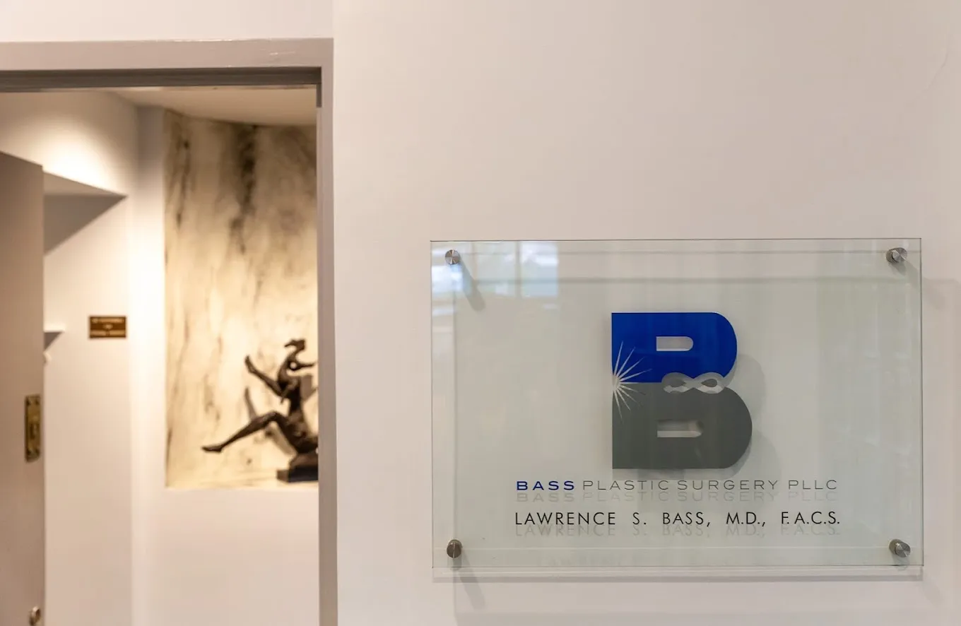 Clean, professional medical spa treatment room with neutral tones at Lawrence Bass, MD in New York