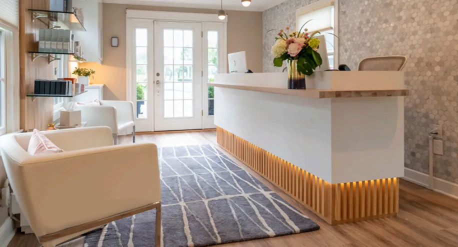 Clean, professional medical spa treatment room with neutral tones at CLARITY MEDICAL AESTHETICS in Guilford