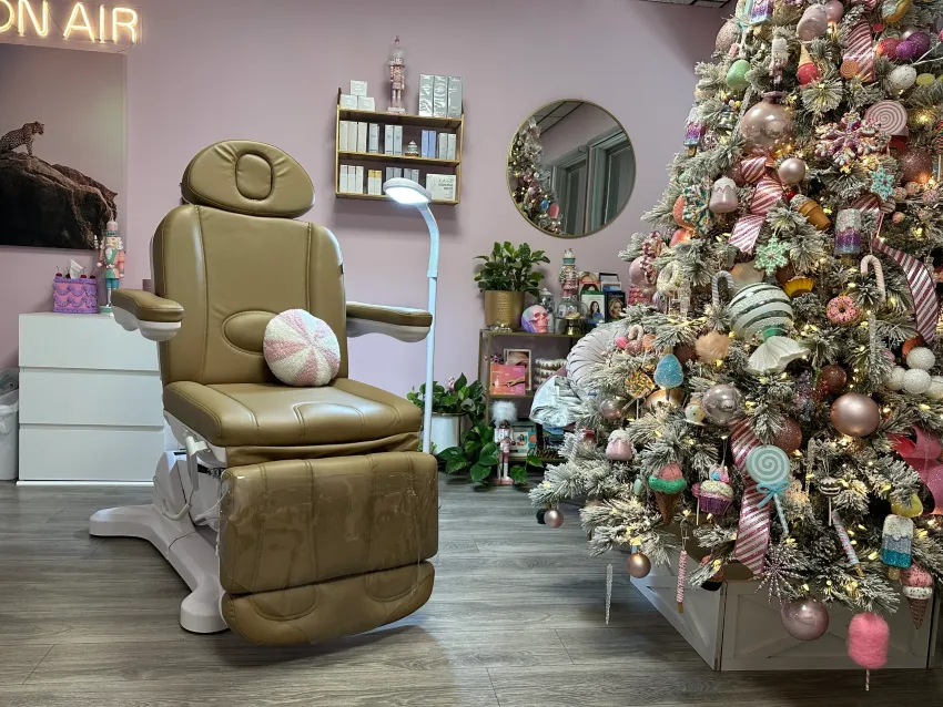 Clean, professional medical spa treatment room with neutral tones at Unfiltered Aesthetics LLC in Rockford