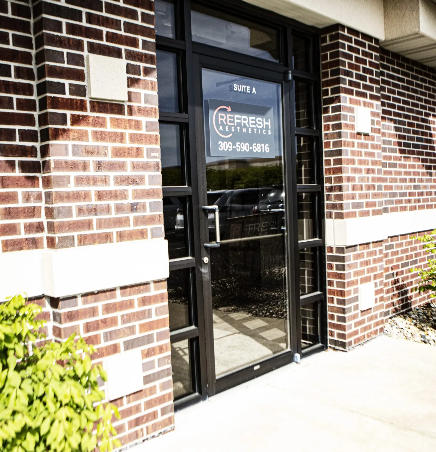 Clean, professional medical spa treatment room with neutral tones at Refresh Aesthetics in Bloomington