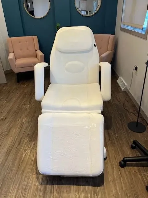 Clean, professional medical spa treatment room with neutral tones at Simply Revived in Pewaukee