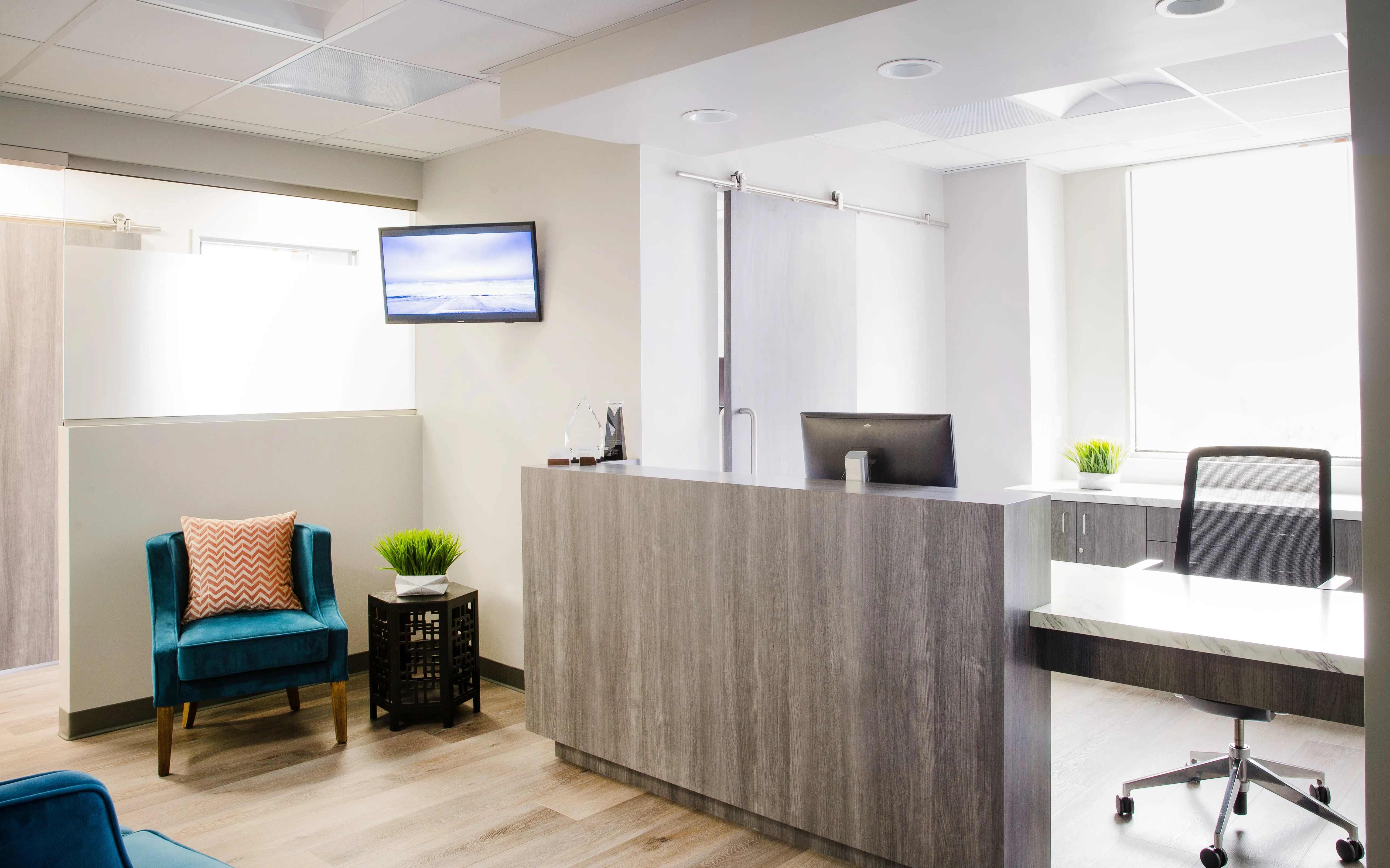 Clean, professional medical spa treatment room with neutral tones at Allure MD in Newport Beach