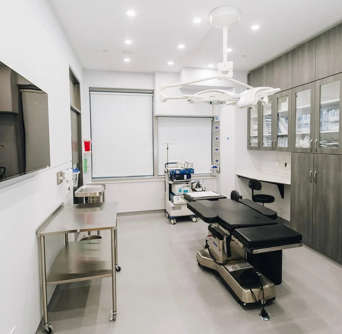 Clean, professional medical spa treatment room with neutral tones at Adam Schaffner in New York