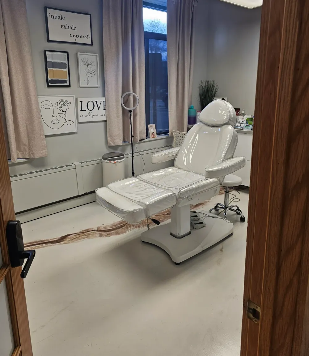 Clean, professional medical spa treatment room with neutral tones at Naturelle Medspa in Wheaton