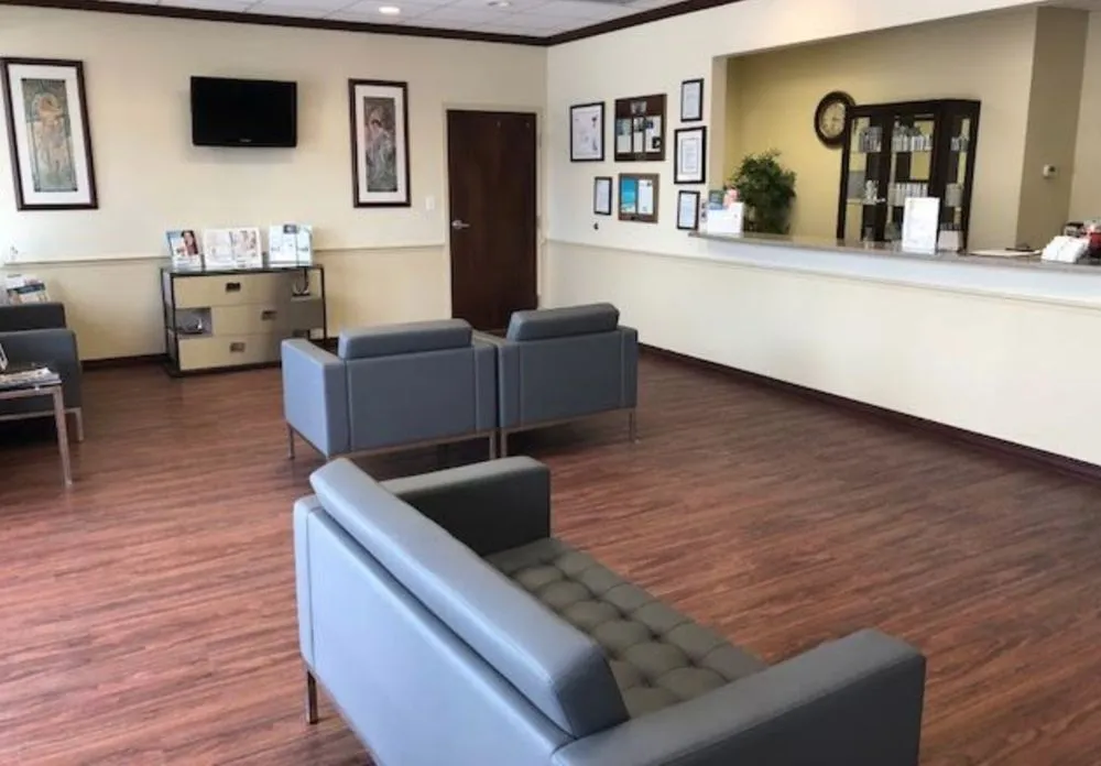 Clean, professional medical spa treatment room with neutral tones at Premiere Cntr for Cosmetic Surgery in Tampa